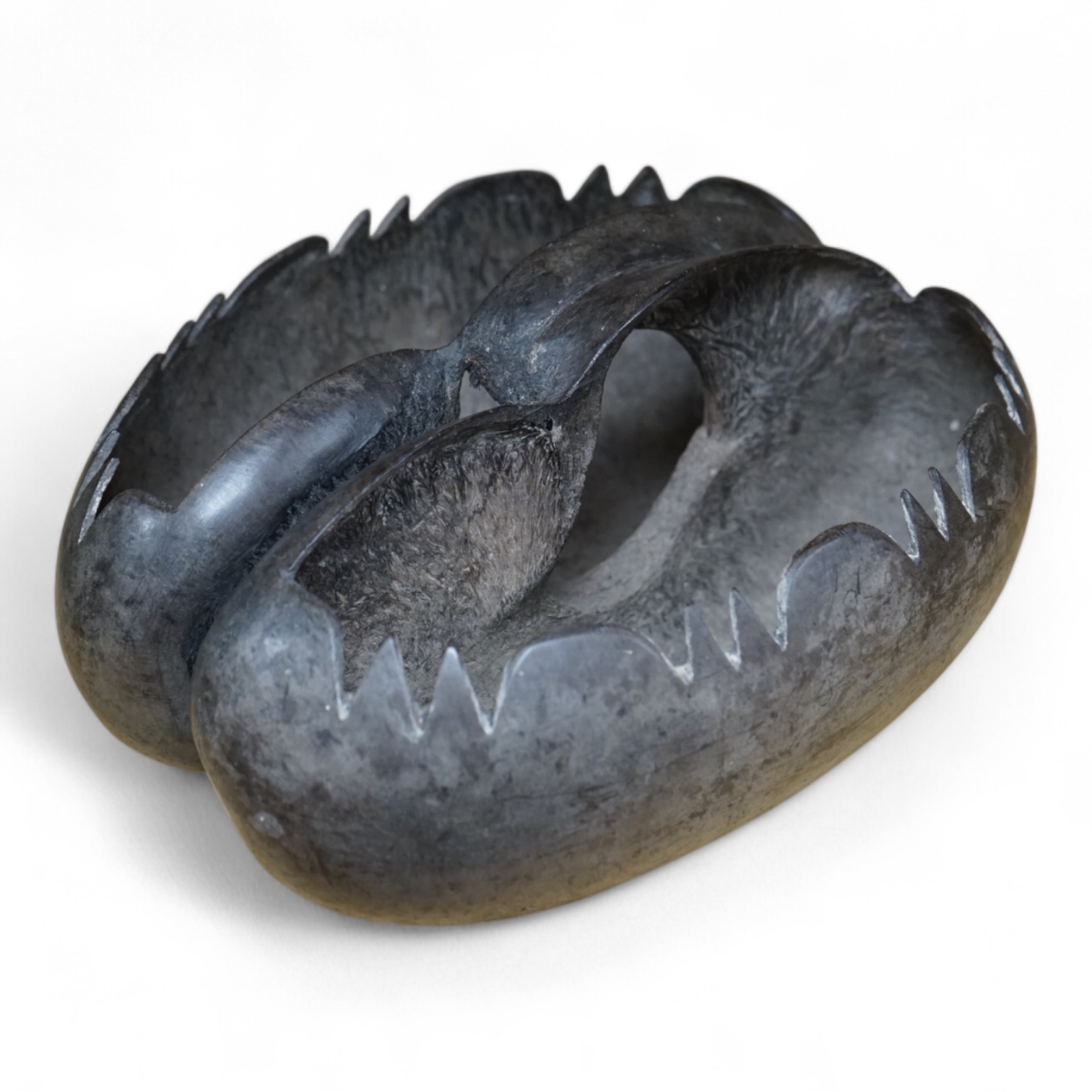 A carved coco de mer basket, 26cm in length. Condition - good